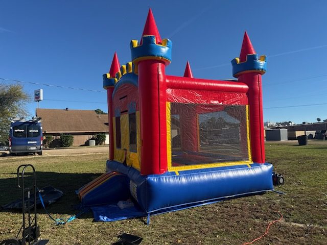 Castle-style jump house set up for an event